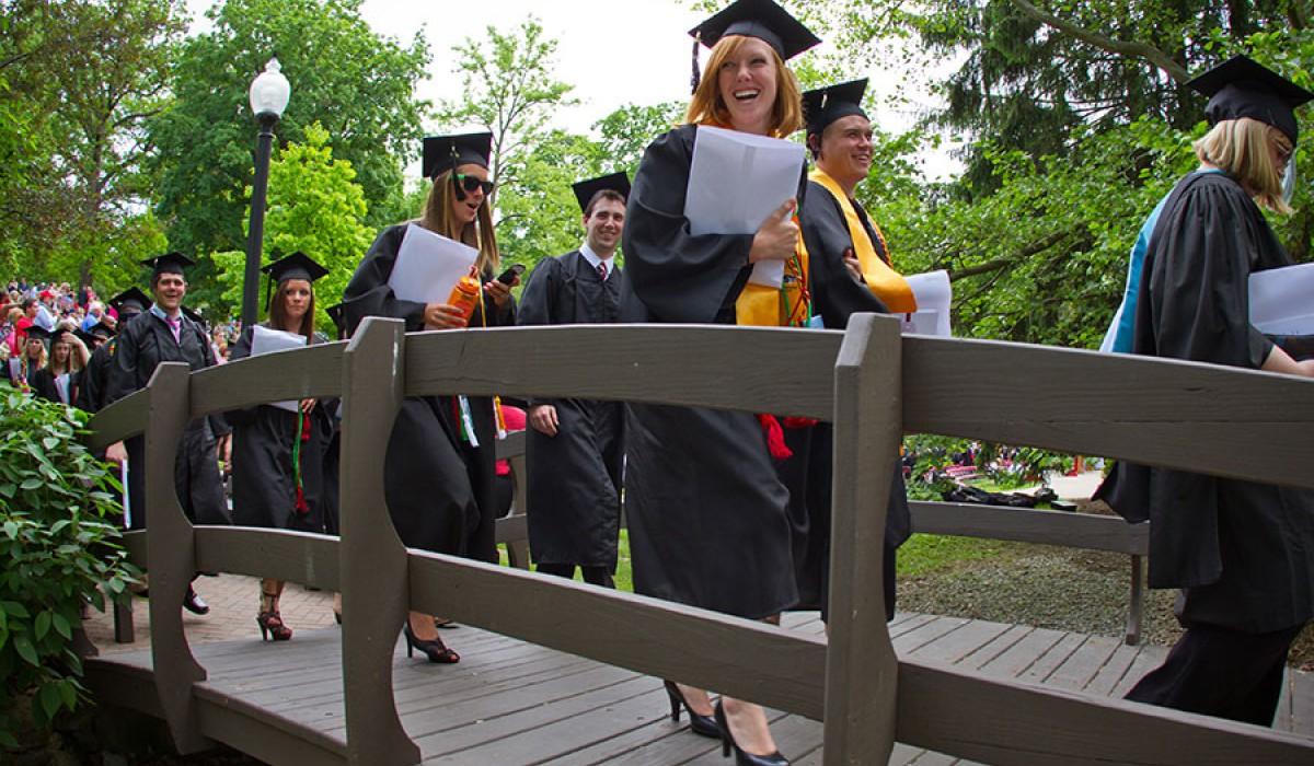 Graduates walking on kissing bridge